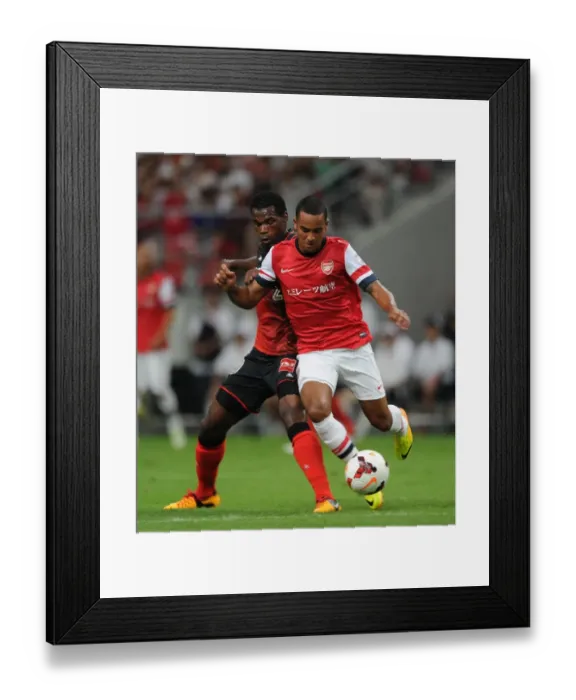 Framed Print : Theo Walcott Fouls by Danilson during Nagoya Grampus vs Arsenal Match, 2013 Framed Print : Theo Walcott Fouls by Danilson during Nagoya Grampus vs Arsenal Match, 2013