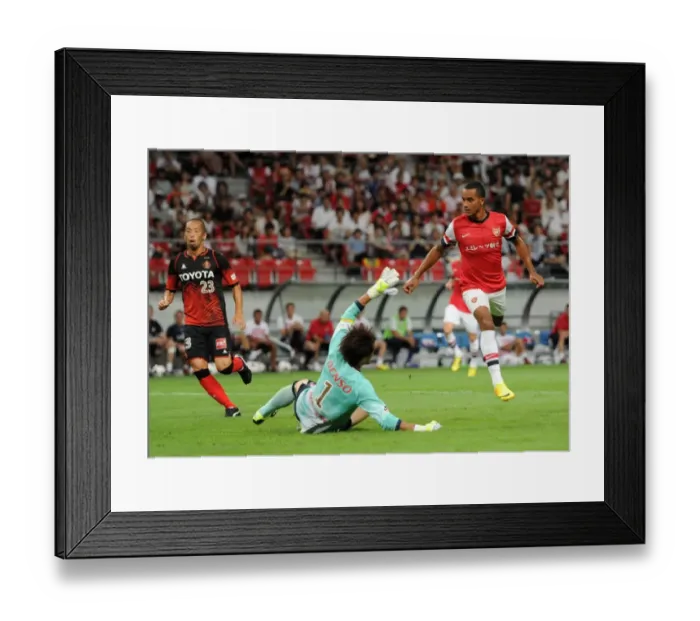 Framed Print : Theo Walcott Scores Against Nagoya Grampus in Arsenal's 2013 Pre-Season Match