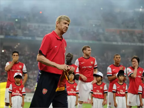 Arsene Wenger with Nagoya Grampus Pennant before Arsenal's 2013 Pre-season Match in Japan