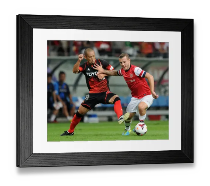 Framed Print : Jack Wilshere vs Yosuke Ishibitsu: Nagoya Grampus vs Arsenal, 2013