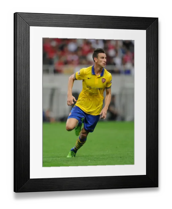 Framed Print : Arsenal's Koscielny in Action: Urawa Red Diamonds vs Arsenal (2013)