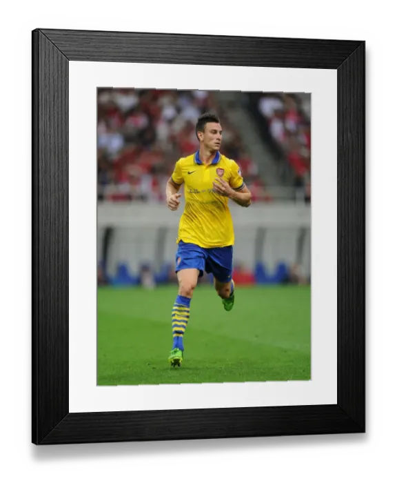 Framed Print : Arsenal's Koscielny Takes on Urawa Red Diamonds in 2013 Pre-Season Clash