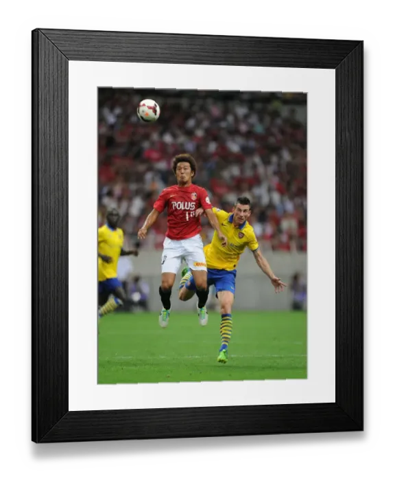 Framed Print : Clash in Japan: Koscielny vs. Sakano - Urawa Red Diamonds vs. Arsenal (2013) Framed Print : Clash in Japan: Koscielny vs. Sakano - Urawa Red Diamonds vs. Arsenal (2013)