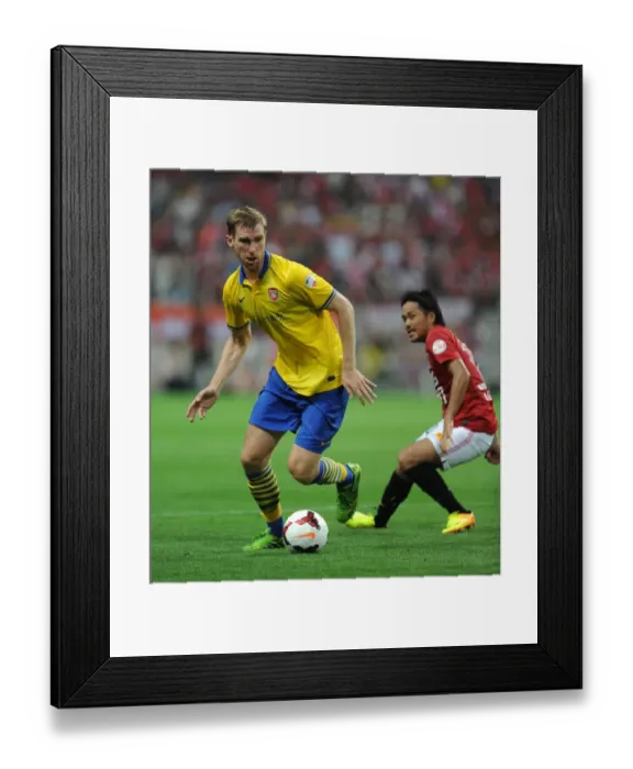 Framed Print : Per Mertesacker Faces Off Against Shinzo Koroki in Arsenal's 2013 Pre-Season Clash with Urawa Red Diamonds Framed Print : Per Mertesacker Faces Off Against Shinzo Koroki in Arsenal's 2013 Pre-Season Clash with Urawa Red Diamonds