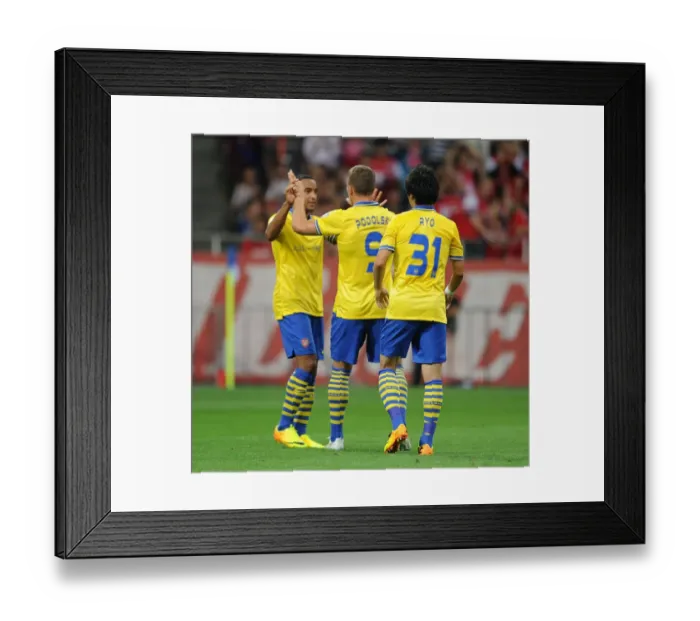 Framed Print : Arsenal's Podolski, Walcott, and Miyaichi Celebrate Goal against Urawa Red Diamonds (2013)