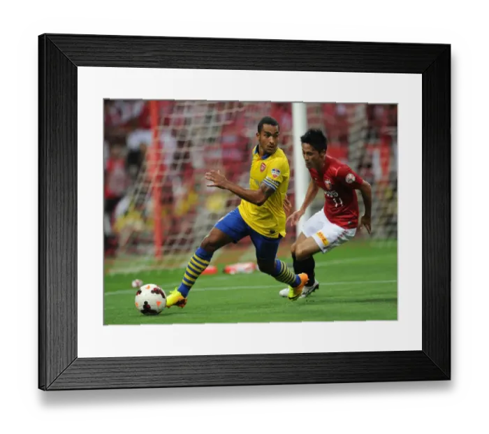 Framed Print : Theo Walcott vs. Kunimitsu Sekiguchi: A Battle for Ball Possession in Arsenal's 2013-14 Pre-Season Clash Framed Print : Theo Walcott vs. Kunimitsu Sekiguchi: A Battle for Ball Possession in Arsenal's 2013-14 Pre-Season Clash