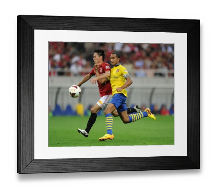 Framed Print : Arsenal's East Asian Showdown: Theo Walcott vs. Kunimitsu Sekiguchi