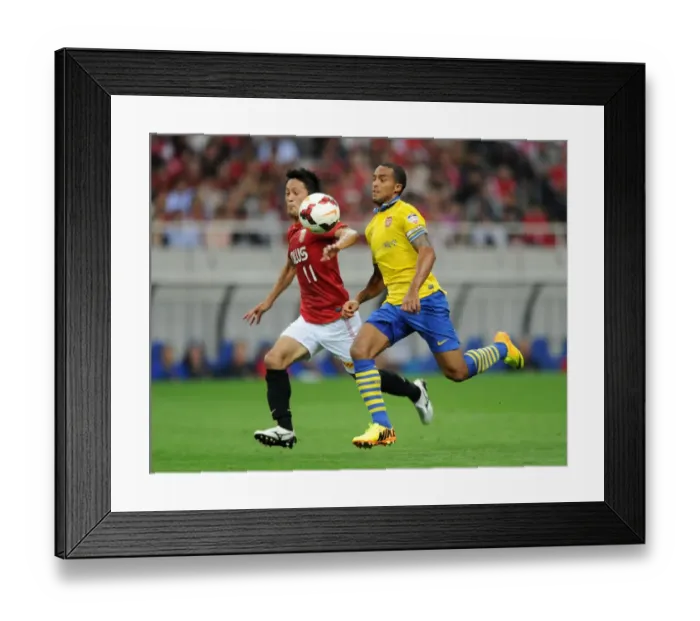 Framed Print : Arsenal's East Asian Battle: Theo Walcott vs. Kunimitsu Sekiguchi (2013)