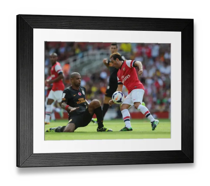 Framed Print : Santi Cazorla vs. Felipe Melo: Battle in the Emirates Cup Framed Print : Santi Cazorla vs. Felipe Melo: Battle in the Emirates Cup