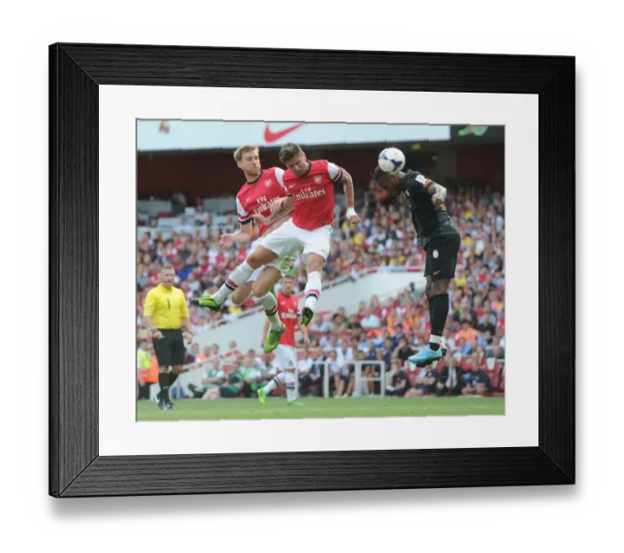 Framed Print : Per Mertesacker and Olivier Giroud (Arsenal) Didier Drogba (Galatasaray). Arsenal 1: 2 Galatasaray