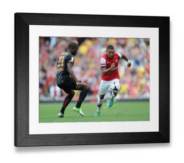 Framed Print : Arsenal's Oxlade-Chamberlain Outmaneuvers Galatasaray's Chedjou in Emirates Cup Clash Framed Print : Arsenal's Oxlade-Chamberlain Outmaneuvers Galatasaray's Chedjou in Emirates Cup Clash