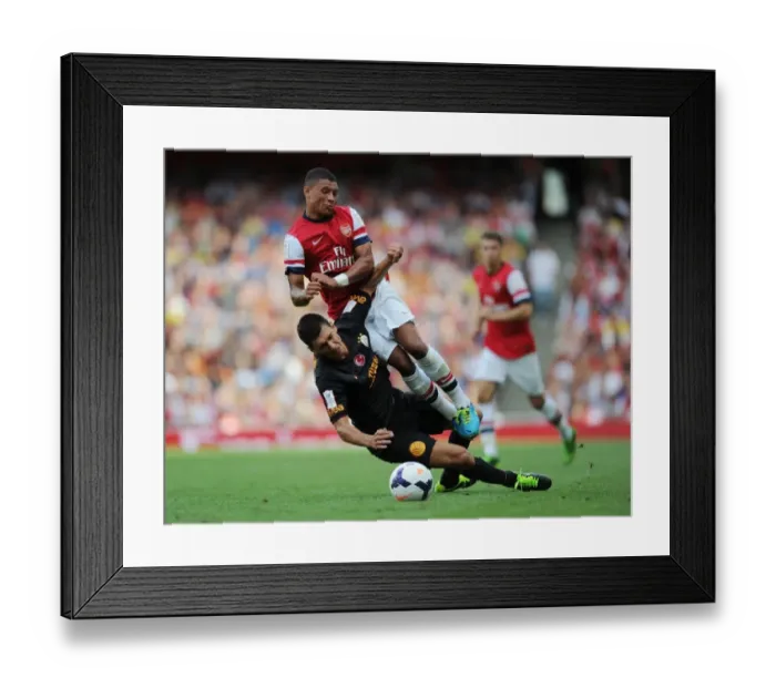 Framed Print : Arsenal's Alex Oxlade-Chamberlain Fouls by Galatasaray's Ceyhun Gulselam - Emirates Cup 2013