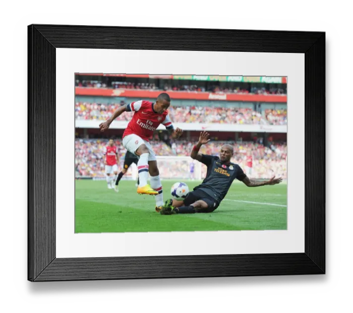 Framed Print : Theo Walcott vs. Felipe Melo: Galatasaray's Upset Over Arsenal in Emirates Cup Day Two Framed Print : Theo Walcott vs. Felipe Melo: Galatasaray's Upset Over Arsenal in Emirates Cup Day Two