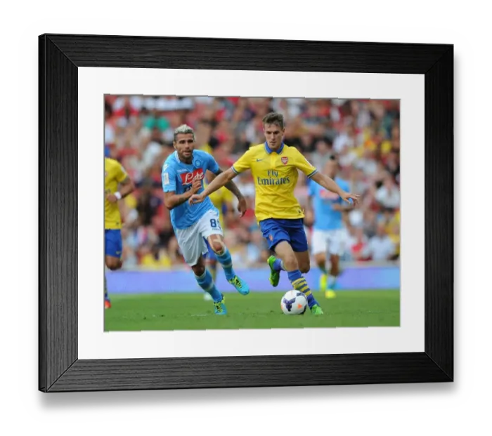 Framed Print : Arsenal's Aaron Ramsey Outmaneuvers Napoli's Valon Behrami during the 2013 Emirates Cup Match Framed Print : Arsenal's Aaron Ramsey Outmaneuvers Napoli's Valon Behrami during the 2013 Emirates Cup Match