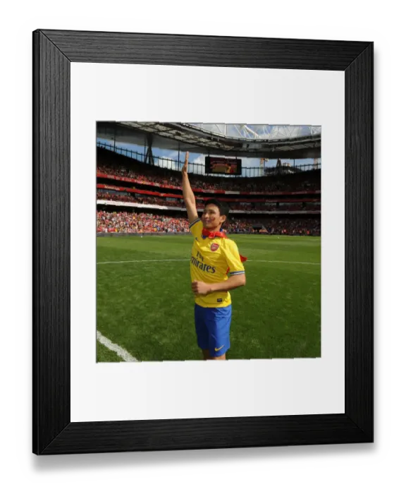 Framed Print : Running Man's Energetic Welcome: Arsenal vs Napoli, Emirates Cup 2013