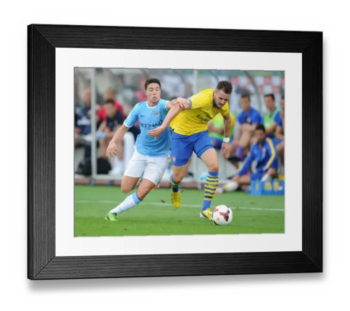 Framed Print : Arsenal's Carl Jenkinson Stands Strong Against Samir Nasri in Pre-Season Showdown