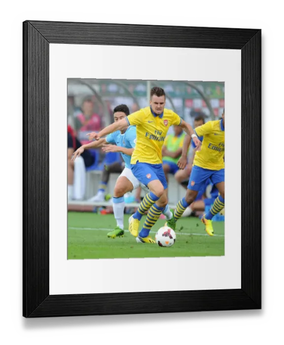 Framed Print : Arsenal's Carl Jenkinson Stands Firm Against Manchester City's Samir Nasri Framed Print : Arsenal's Carl Jenkinson Stands Firm Against Manchester City's Samir Nasri