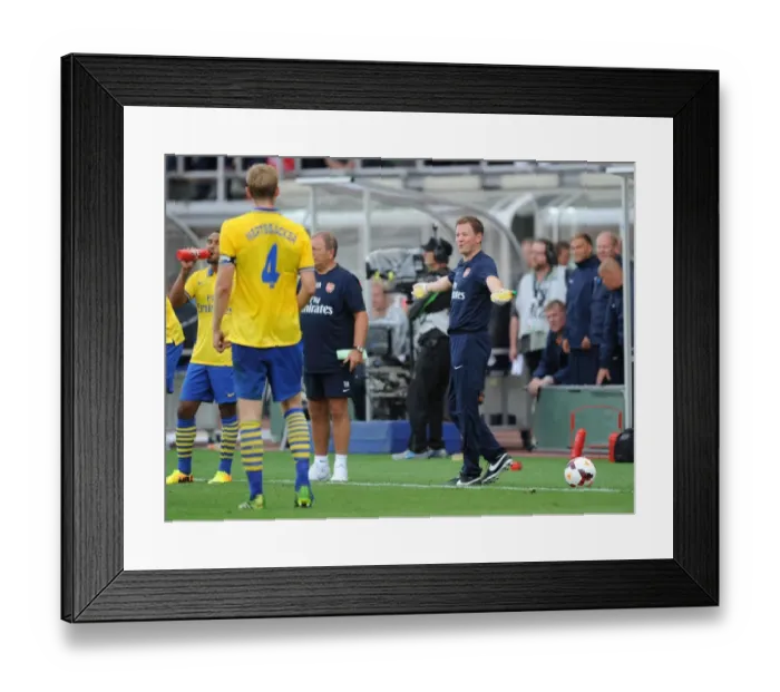 Framed Print : Arsenal vs Manchester City: Pre-Season Friendly - Arsenal Physio Colin Lewin at Olympic Stadium, Helsinki (2013)