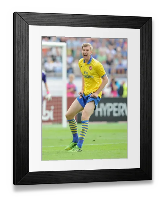 Framed Print : Arsenal's Per Mertesacker in Action against Manchester City in 2013 Pre-Season Friendly