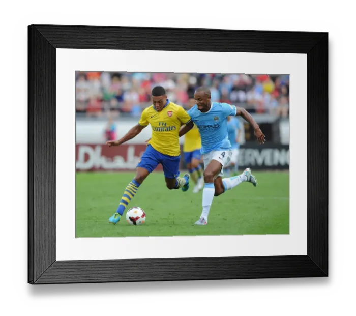 Framed Print : Alex Oxlade-Chamberlain Outsmarts Vincent Kompany: A Masterful Dodge at Arsenal vs. Manchester City