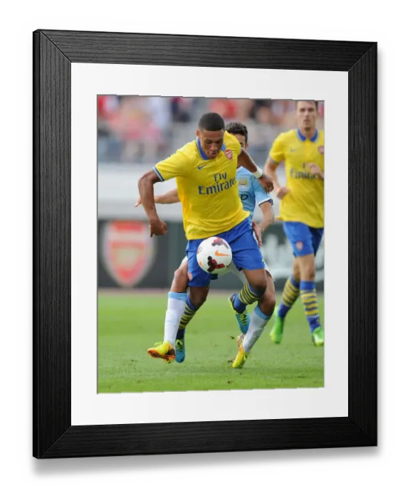 Framed Print : Arsenal's Alex Oxlade-Chamberlain vs Manchester City's Jesus Navas - Pre-Season Clash in Helsinki, 2013