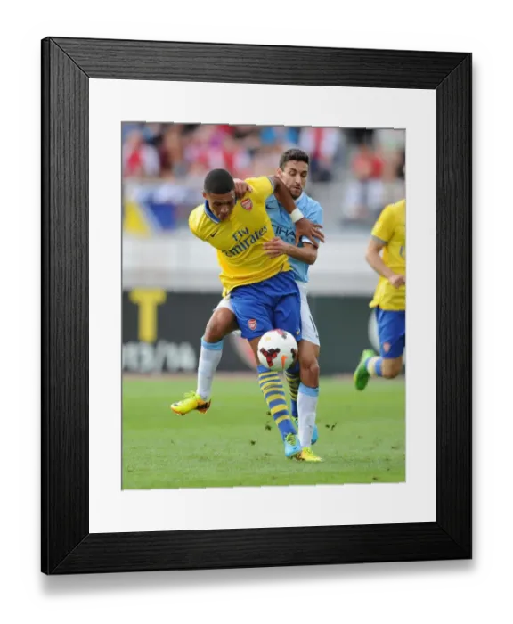 Framed Print : Arsenal's Oxlade-Chamberlain vs. Navas Manchester City: A Pre-Season Showdown in Helsinki Framed Print : Arsenal's Oxlade-Chamberlain vs. Navas Manchester City: A Pre-Season Showdown in Helsinki