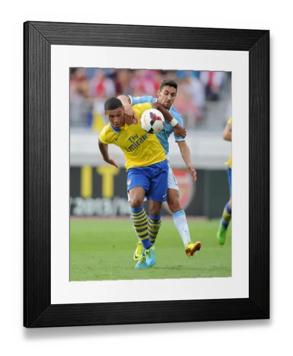 Framed Print : Battle of the Wings: Oxlade-Chamberlain vs. Navas in Arsenal's Pre-Season Clash with Manchester City, 2013
