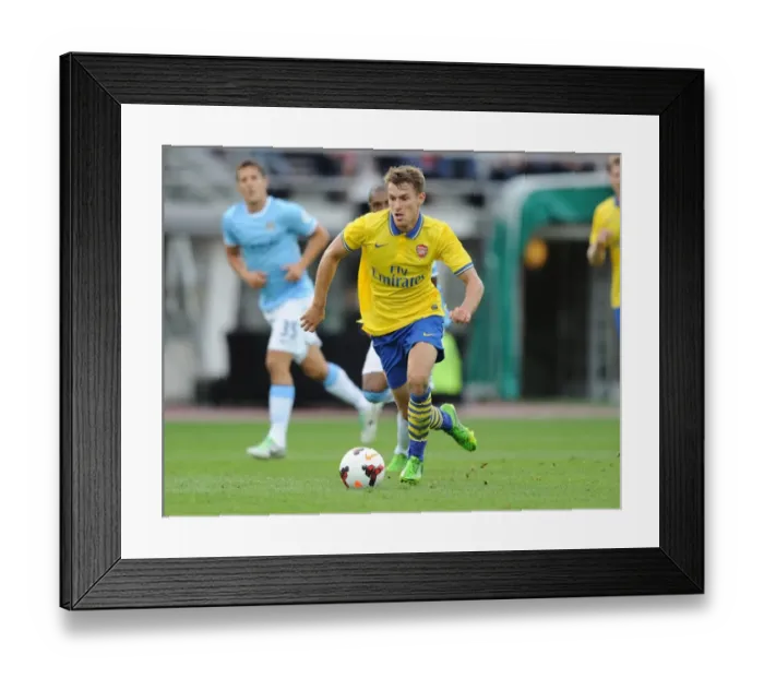 Framed Print : Arsenal's Aaron Ramsey Faces Off Against Manchester City in 2013 Pre-Season Clash