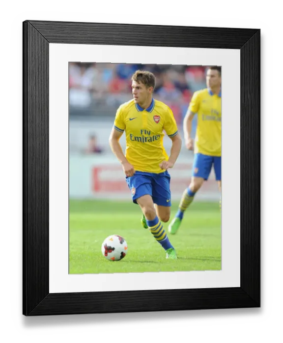 Framed Print : Arsenal's Aaron Ramsey Takes on Manchester City in Pre-Season Showdown, 2013