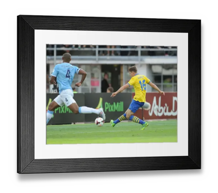 Framed Print : Aaron Ramsey Scores Past Vincent Kompany: Arsenal vs. Manchester City Pre-Season Clash, Finland 2013