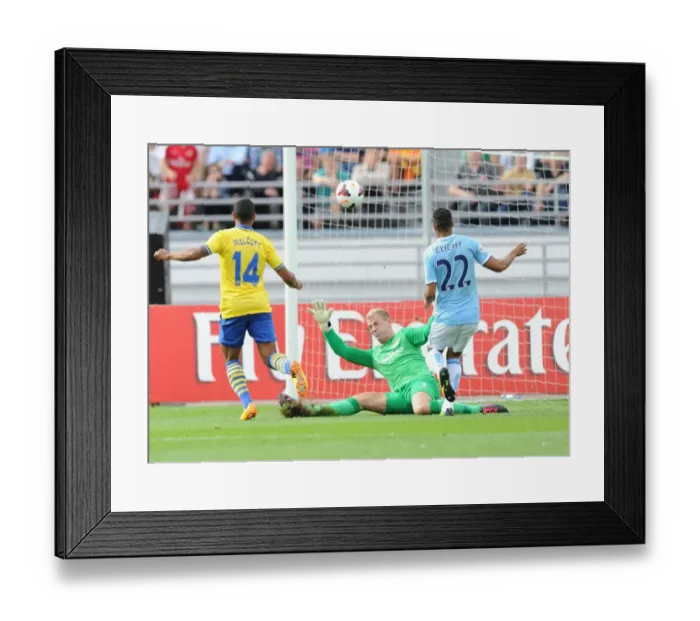 Framed Print : Theo Walcott Scores the Opener: Arsenal vs. Manchester City Pre-Season Friendly 2013