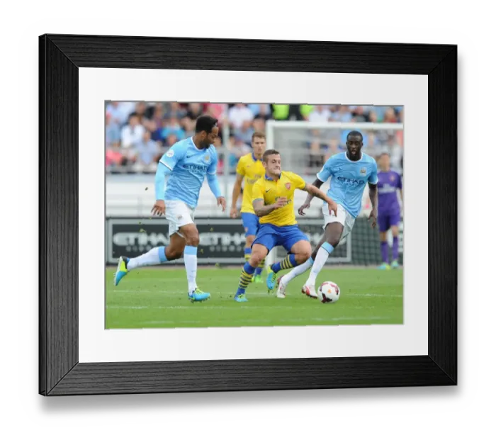 Framed Print : Arsenal's Jack Wilshere Clashes with Manchester City's Yaya Toure and Joleon Lescott during Pre-Season Friendly