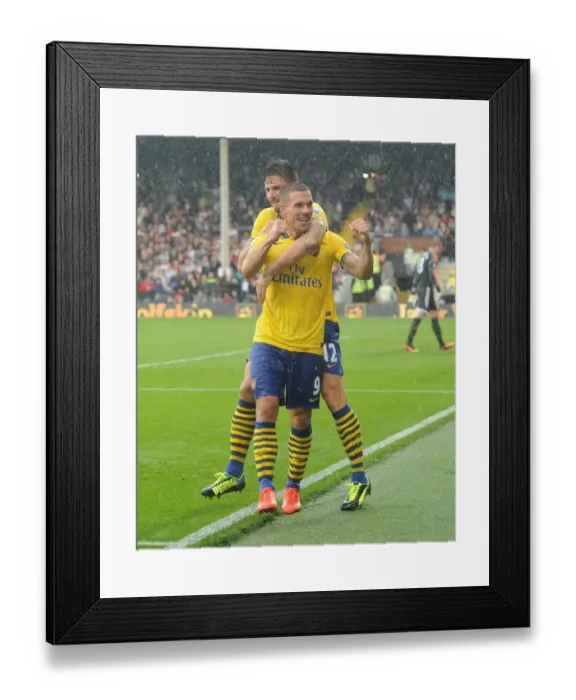 Framed Print : Euphoria Unleashed: Podolski and Giroud's Triumphant Moment as Arsenal Scores the Third Goal Against Fulham (2013-14)