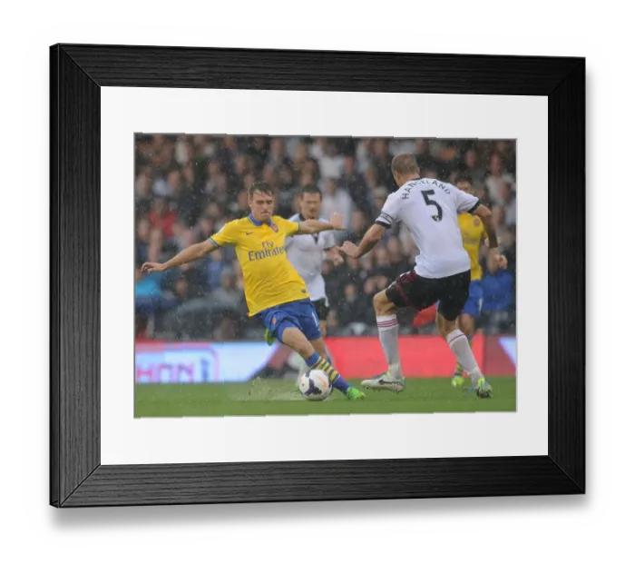 Framed Print : Clash of Titans: Ramsey vs. Hangeland - Fulham vs. Arsenal, Premier League 2013-14