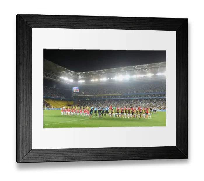 Framed Print : Fenerbahce SK v Arsenal - UEFA Champions League Play-offs: First Leg