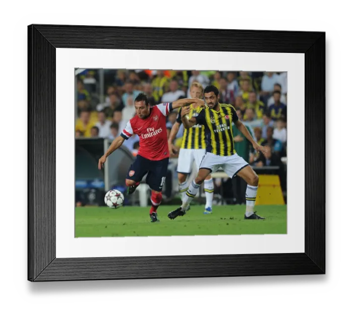 Framed Print : Santi Cazorla's Agile Moves: Outmaneuvering Fenerbahce's Bekir Irtgun in Arsenal's Champions League Showdown (2013)