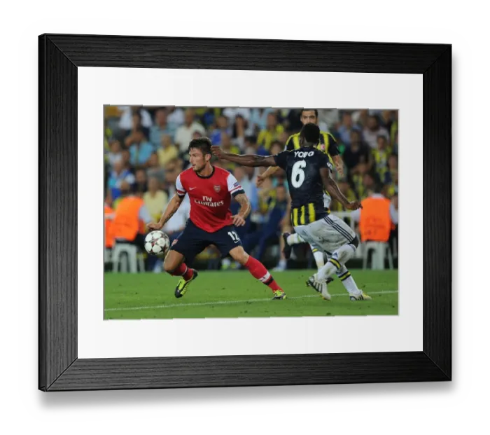 Framed Print : Olivier Giroud vs. Joseph Yobo: Arsenal's Edge in UEFA Champions League Play-offs against Fenerbahce