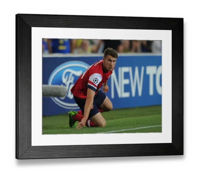 Framed Print : Arsenal's Aaron Ramsey Faces Fenerbahce in UEFA Champions League Play-offs, Istanbul, 2013