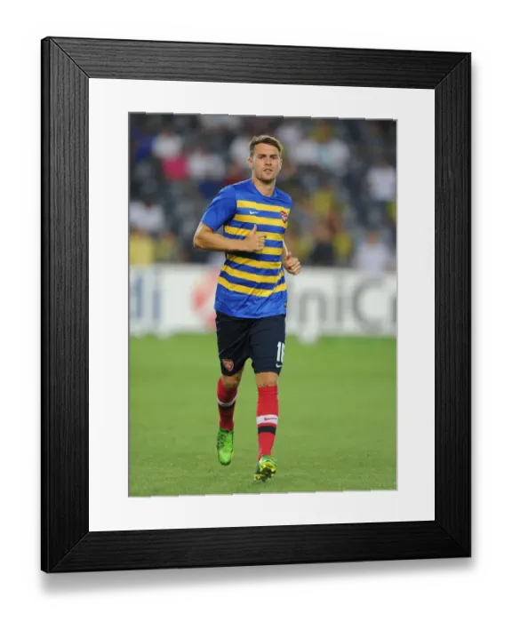 Framed Print : Arsenal's Aaron Ramsey Prepares for Fenerbahce Showdown in UEFA Champions League Play-offs Framed Print : Arsenal's Aaron Ramsey Prepares for Fenerbahce Showdown in UEFA Champions League Play-offs
