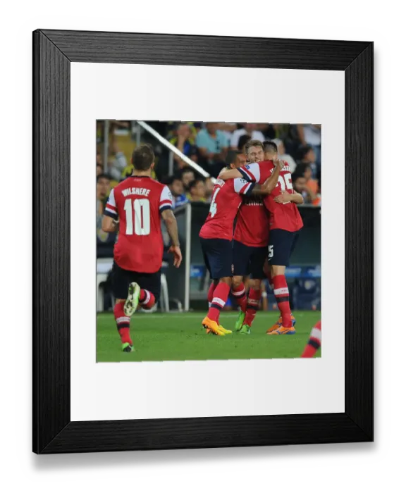 Framed Print : Arsenal's Triumph: Ramsey, Wilshere, Walcott Celebrate Goals Against Fenerbahce in Champions League Play-offs