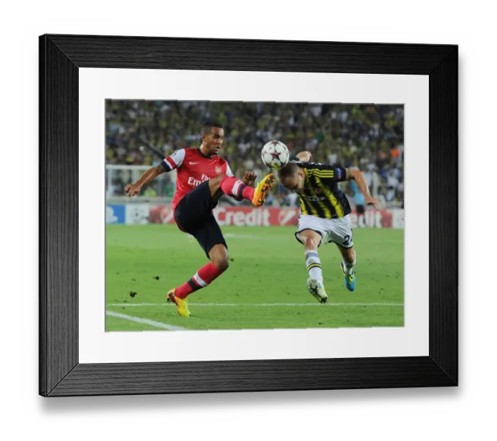 Framed Print : Theo Walcott vs. Michal Kadlec: A Clash in the UEFA Champions League Play-offs between Fenerbahce and Arsenal