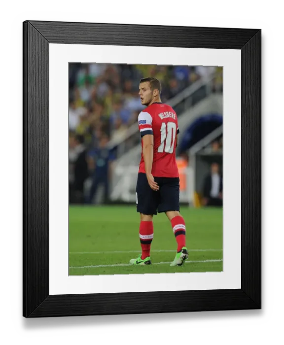 Framed Print : Jack Wilshere in Action: Arsenal vs. Fenerbahce, UEFA Champions League Play-offs (2013)