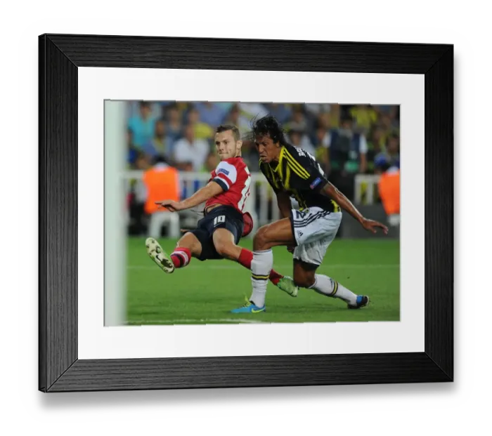Framed Print : Jack Wilshere vs Bruno Alves: Battle in Istanbul - Arsenal's Champions League Play-offs Clash with Fenerbahce