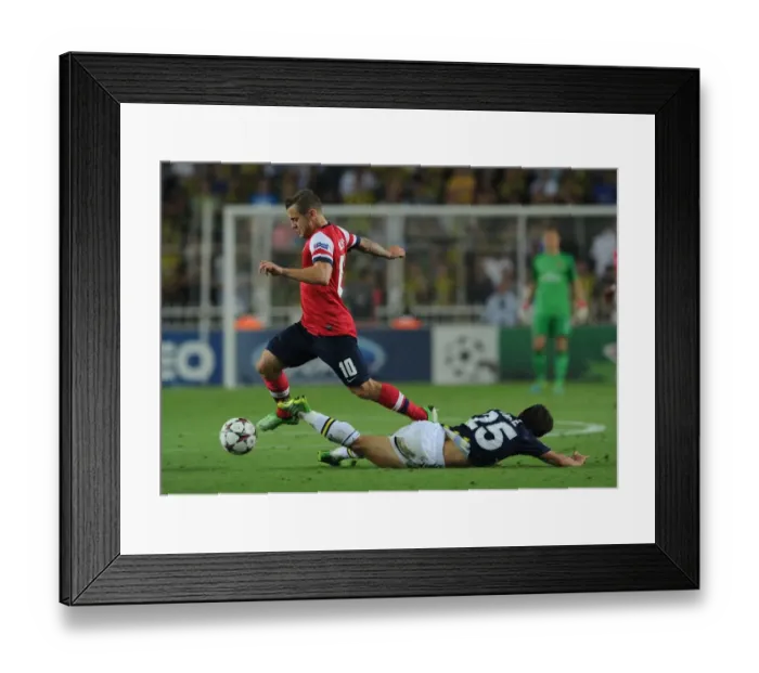 Framed Print : Clash of Midfielders: Wilshere vs. Belozoglu - Fenerbahce vs. Arsenal, UEFA Champions League Play-offs