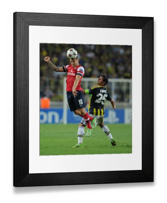 Framed Print : Clash of Midfield Titans: Wilshere vs. Belozoglu - Arsenal vs. Fenerbahce, UEFA Champions League Play-offs, Istanbul, Turkey, 2013