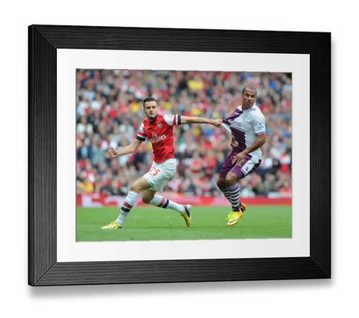 Framed Print : Arsenal vs. Aston Villa: Jenkinson vs. Agbonlahor in Intense Battle at Emirates Stadium Framed Print : Arsenal vs. Aston Villa: Jenkinson vs. Agbonlahor in Intense Battle at Emirates Stadium