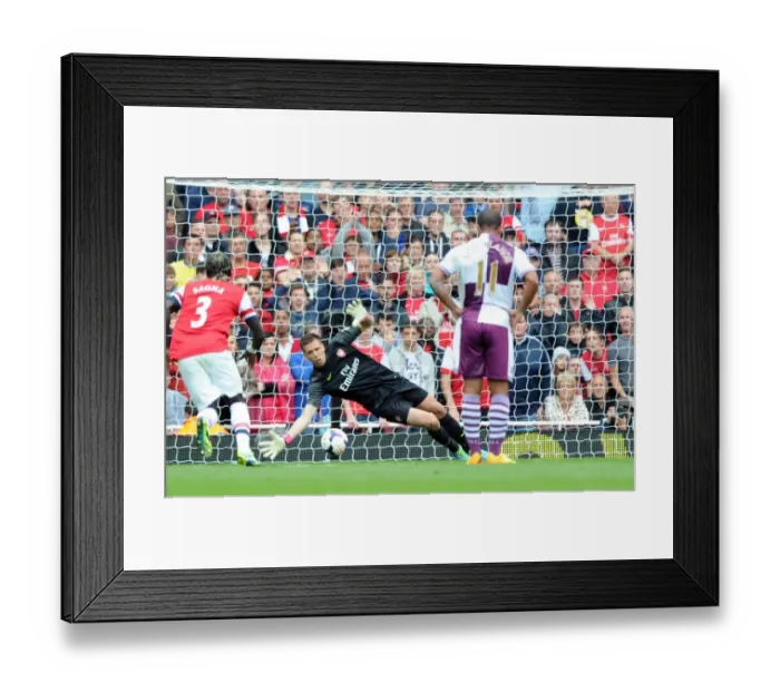 Framed Print : Arsenal's Szczesny Stops Benteke's Penalty in 2013-14 Arsenal v Aston Villa Premier League Clash
