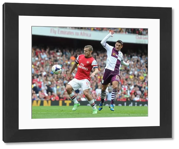 Arsenal's Jack Wilshere Surges Past Aston Villa's Ashley Westwood in 2013-14 Premier League Clash