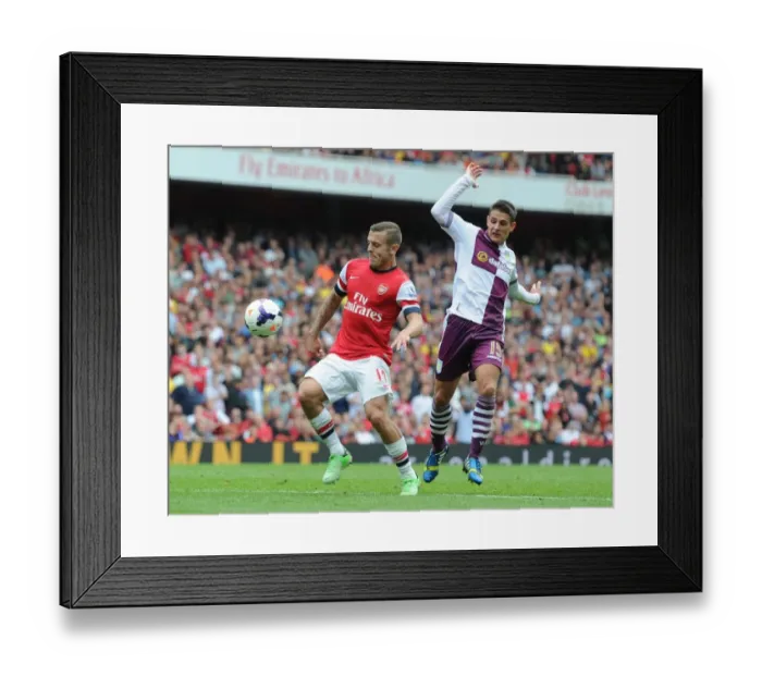 Framed Print : Arsenal's Jack Wilshere Surges Past Aston Villa's Ashley Westwood in 2013-14 Premier League Clash Framed Print : Arsenal's Jack Wilshere Surges Past Aston Villa's Ashley Westwood in 2013-14 Premier League Clash