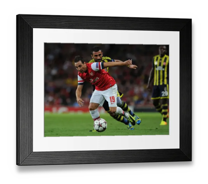 Framed Print : Santi Cazorla Drives Past Selcuk Sahin: Arsenal vs. Fenerbahce UEFA Champions League Play-offs (2013)